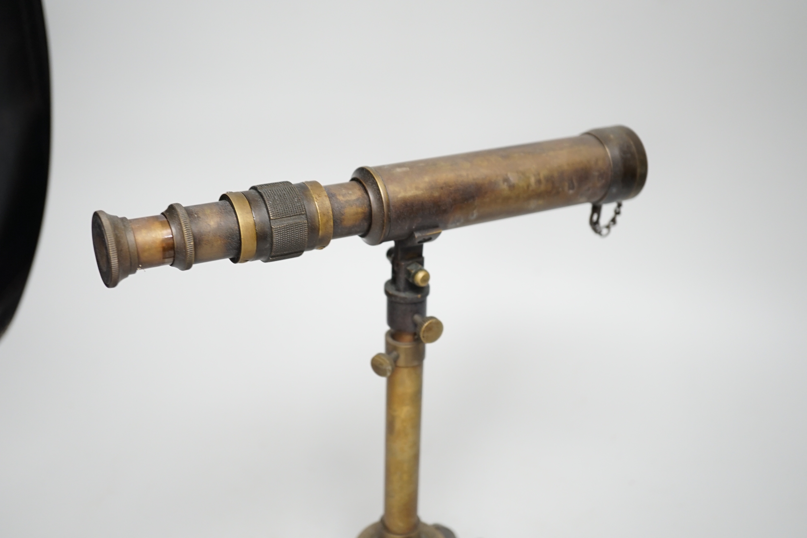 A brass telescope on tripod stand, signed Ottway, Ealing, 28cm high, together with a three-draw telescope